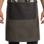 Durable gray leather cooking apron with pockets and cross-back straps